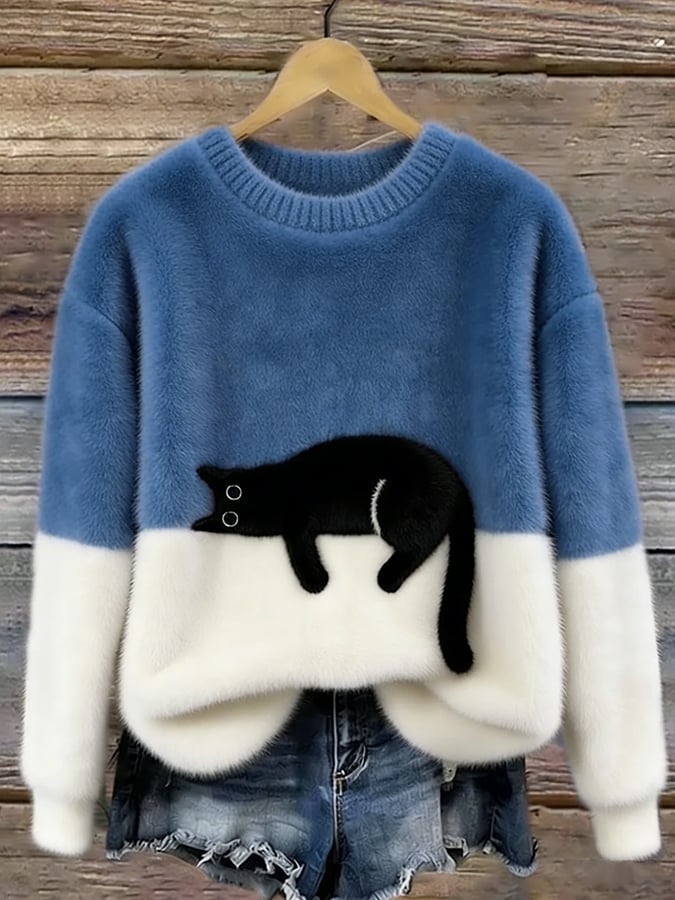 Femme portant pull tricot motif chat endormi