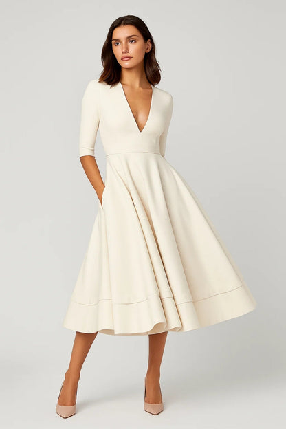 Robe midi élégante | Coupe évasée | Décolleté en V profond | Silhouette féminine pour un style intemporel de mi-saison