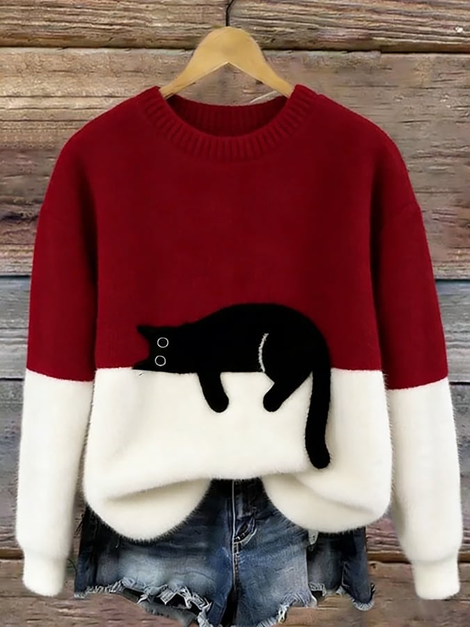 Femme portant pull tricot motif chat endormi